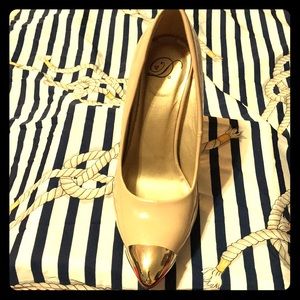 Beige high heels with gold metal tip